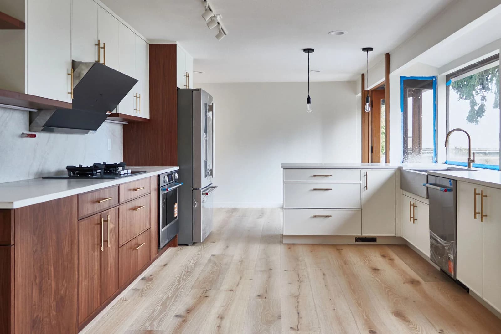 Walnut kitchen with white stone counters, Bellevue, WA, kitchen remodeling by AIM Builders